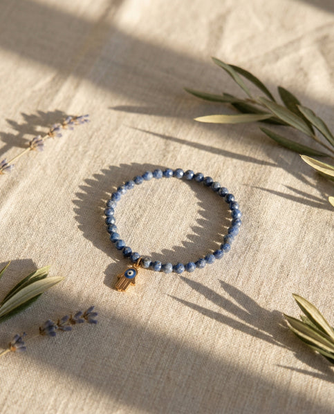 Handmade natural Lapis Lazuli healing bracelet with deep blue gemstone beads and gold pyrite flecks. A spiritual jewelry piece for wisdom, truth, and Third Eye Chakra healing by Oneness Living. 100% vegan.