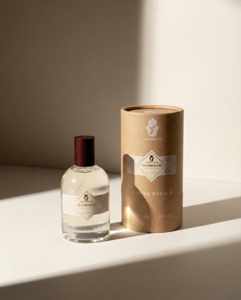 Luxury 100ml bottle of Champagne Eau de Parfum by Oneness Living. A sparkling and radiant feminine fragrance with notes of orange, tiaré flowers, and warm vanilla.