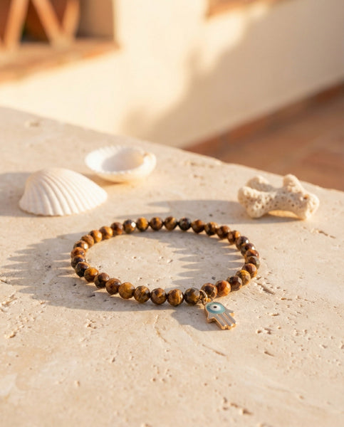 Handmade natural Tiger's Eye healing bracelet with golden brown chatoyant gemstone beads. A spiritual jewelry piece for courage, strength, and Solar Plexus Chakra balance by Oneness Living. 100% vegan.