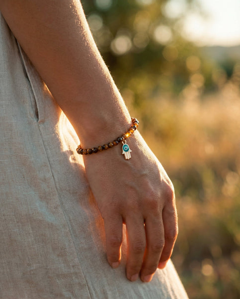 Handmade natural Tiger's Eye healing bracelet with golden brown chatoyant gemstone beads. A spiritual jewelry piece for courage, strength, and Solar Plexus Chakra balance by Oneness Living. 100% vegan.