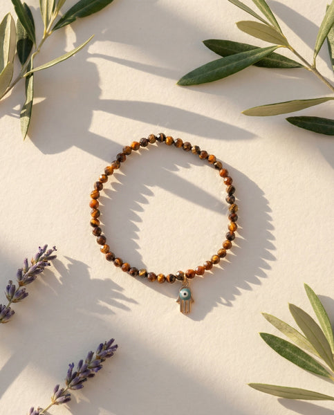 Handmade natural Tiger's Eye healing bracelet with golden brown chatoyant gemstone beads. A spiritual jewelry piece for courage, strength, and Solar Plexus Chakra balance by Oneness Living. 100% vegan.