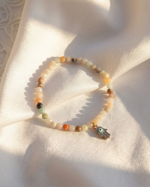 Handmade natural Amazonite healing bracelet with soothing mint green gemstone beads. A spiritual jewelry piece for communication, emotional balance, and Throat Chakra healing by Oneness Living. 100% vegan.