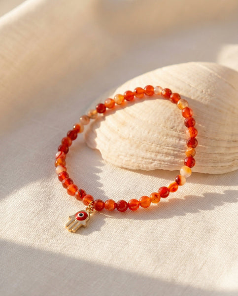 Handmade natural Carnelian healing bracelet with vibrant orange gemstone beads. A spiritual jewelry piece for motivation, creativity, and Sacral Chakra healing by Oneness Living. 100% vegan.