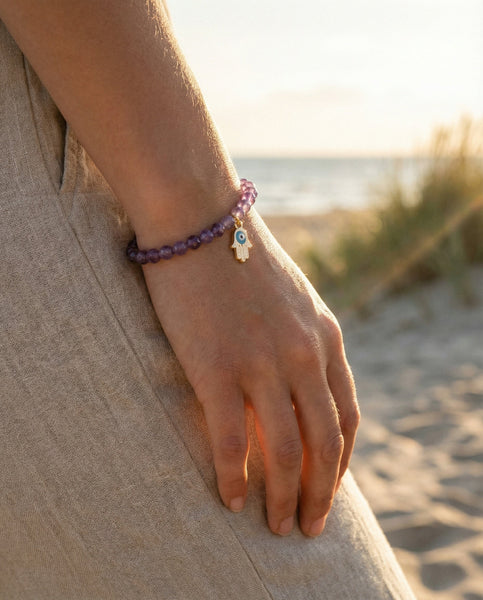 Handmade natural Amethyst healing bracelet with deep purple gemstone beads. A spiritual jewelry piece for intuition, meditation, and Crown Chakra healing by Oneness Living. 100% vegan.