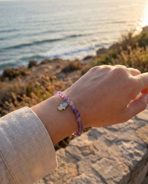 Handmade natural Amethyst healing bracelet with deep purple gemstone beads. A spiritual jewelry piece for intuition, meditation, and Crown Chakra healing by Oneness Living. 100% vegan.