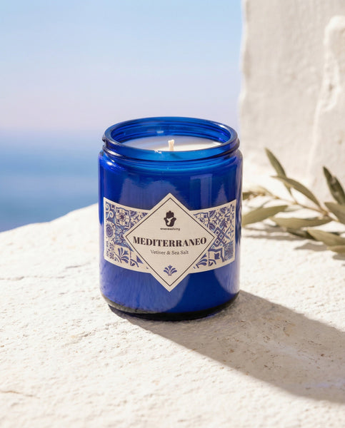 Authentic artisanal scented candle Mediterraneo by Oneness Living. A refreshing decorative candle featuring marine accords, citrus, and aromatic herbs inspired by the Mediterranean coast